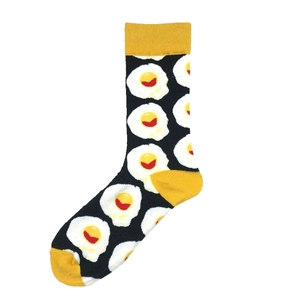Black crew socks with fried egg pattern and yellow accents for men and women