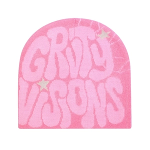 Detailed knit texture of pink beanie with GRIT VISIONS text and star patterns