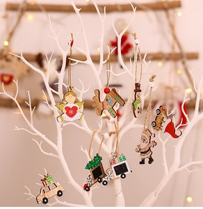Close-up of wooden Christmas tree ornaments with colorful hand-painted festive figures