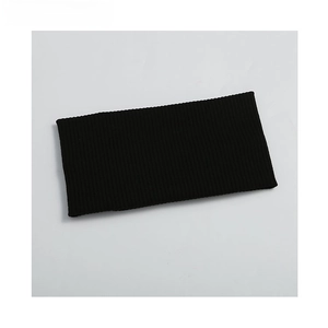 Detail of black ribbed knitted sports headband with soft elastic fabric texture