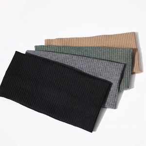 Soft ribbed knitted headbands in black, grey, green, and camel for yoga or sports