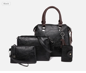 Détail de l'ensemble de 4 sacs en cuir PU noir comprenant un cabas et des bandoulières
