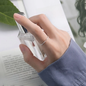 Silver alloy ring with bamboo design, featuring an adjustable open band detail