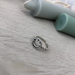 Detailed close-up of a vintage alloy adjustable ring featuring classic smiley face motifs