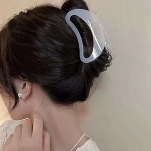 Elegant large translucent arc-shaped hair claw clip for French twist hairstyles