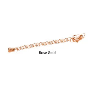 Close-up of rose gold stainless steel extender chain with lobster clasp and drop pendant