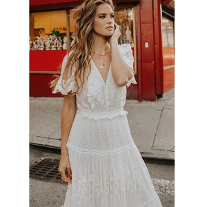 Elegant white lace V-neck tiered dress with puff sleeves and bohemian style pattern