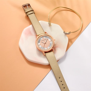Detail of starry dial ladies watch with Roman numerals and matching crescent moon bracelet