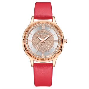 Detailed macro view of the sparkling rhinestone-studded dial and rose gold watch case