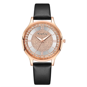 Detail of starry sky watch with diamond-set bezel and black leather strap