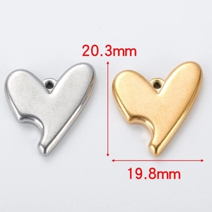 Detailed size view of silver and gold stainless steel heart charms, 20.3mm by 19.8mm