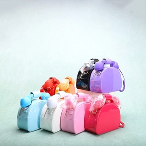 Close-up of creative vintage telephone shaped handbags in various vibrant glossy colors