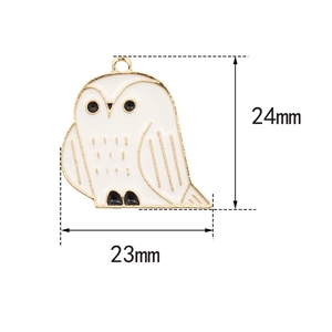 Detailed dimensions of a gold and white enamel owl charm measuring 23mm by 24mm