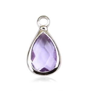 Macro shot of a teardrop-shaped amethyst pendant with a silver metal base and loop