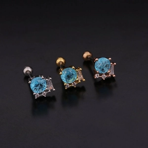 Detailed shot of steel screw-back earrings with blue crackle gems and zircon accents