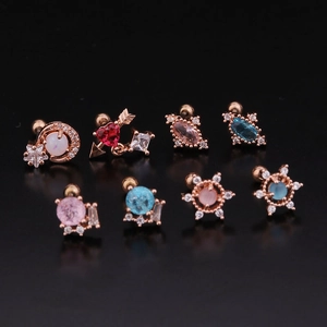 Rose gold stainless steel stud earrings with colorful zircon in various shapes on black background