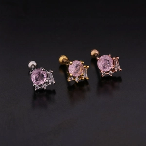 Detailed view of round pink zircon screw back earrings in silver, gold, and rose gold