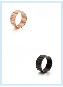 Close-up of gear ridge texture on 316L stainless steel rose gold and black mens rings