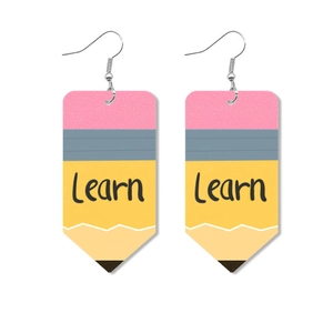Detail view of pencil-shaped leather earrings with Learn text and vibrant tie-dye colors
