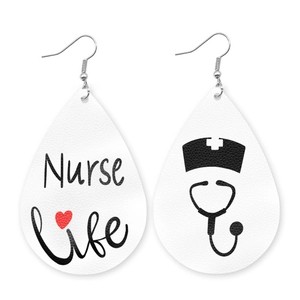 Detail of teardrop leather earrings featuring Nurse Life text and stethoscope pattern