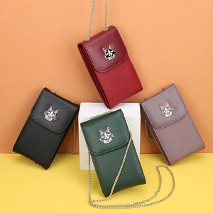 Detail view of quilted leather phone bags with husky icons and golden chain straps in four colors