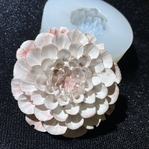 Macro detail of 3D dahlia silicone mold with intricate multi-layer flower resin craft