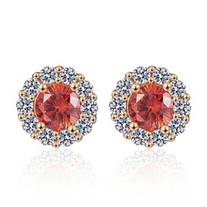 Champagne gold sunflower earrings with a red gemstone center and white zircon halo