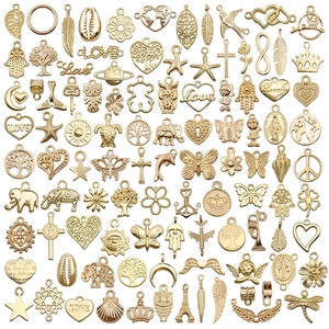 Assorted gold-finished metal charms including hearts and stars for DIY jewelry making