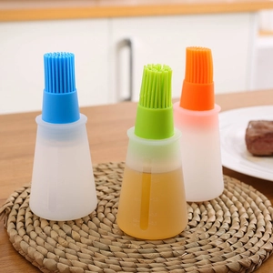 Silicone oil brush bottles with scale markings in blue, green, and orange colors