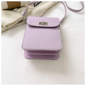 Close-up of light purple mini phone bag with cross-grain leather and silver metal clasp