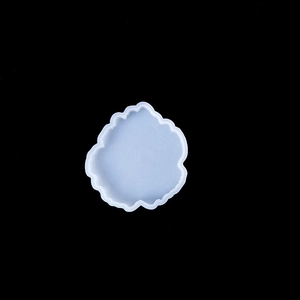 Close-up of flexible light blue scalloped silicone resin mold for DIY coasters