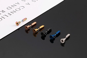 Detailed macro shot of screw-shaped stud earrings in six assorted metallic colors