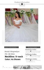 Detailed view of white V-neck wedding dress with lace embroidery and layered tulle fabric