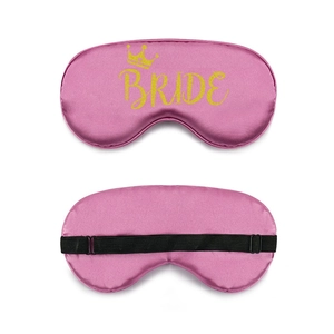 Front and back detail of pink satin bride eye mask with gold crown and adjustable strap