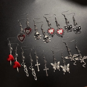 Gothic punk earring collection featuring bat, skull, cross and rose motifs with red oil drip