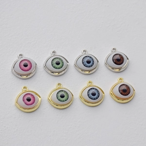 Colorful evil eye charms in gold and silver frames for DIY jewelry making and crafts