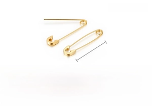 Macro shot of gold stainless steel safety pin earrings with a polished metallic finish