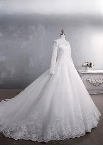 Detail of luxury bridal gown with high collar, lace embroidery, and sequins