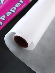 Detailed close-up of white semi-transparent double-sided silicone baking paper roll
