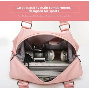 Pink fitness travel bag with large interior capacity and waterproof compartments