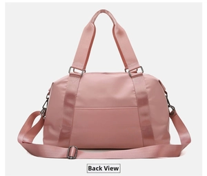 Pink waterproof travel bag showing the convenient back luggage sleeve for suitcase handles