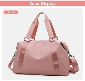 Pink waterproof fitness travel bag with reinforced handles and detachable shoulder strap