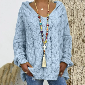 Detailed cable knit pattern on light blue oversized hoodie with textured weaving