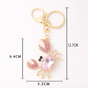 Pink crystal crab keychain in gold alloy finish with dimensions 12.7cm by 5.5cm