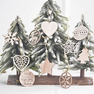 Laser-cut wooden Christmas ornaments set featuring snowflake, deer and heart designs