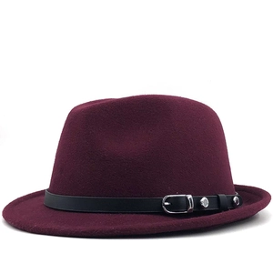 Detail of the deep wine red wool felt fedora with a black leather band and silver buckle