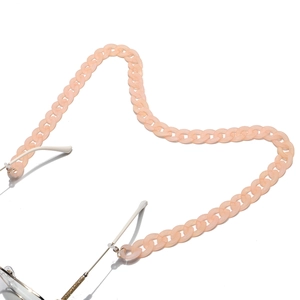 Macro shot of flesh pink matte acrylic eyeglass chain with large flat link loops