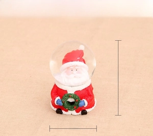 Detailed size display of a Santa Claus resin crystal ball with glass globe ornament