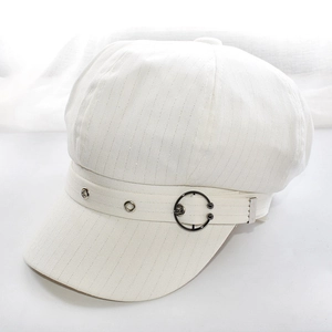 Detail of white newsboy cap with subtle silver glitter stripes and metallic ring accent