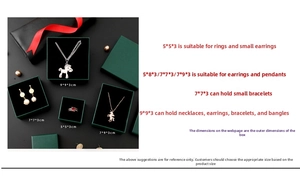 Detailed view of dark green jewelry gift boxes in various sizes with elegant red ribbons